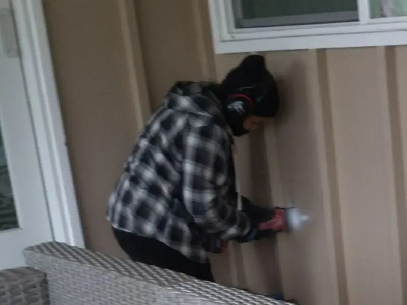 Professional electrician installing an exterior outlet in Ontario